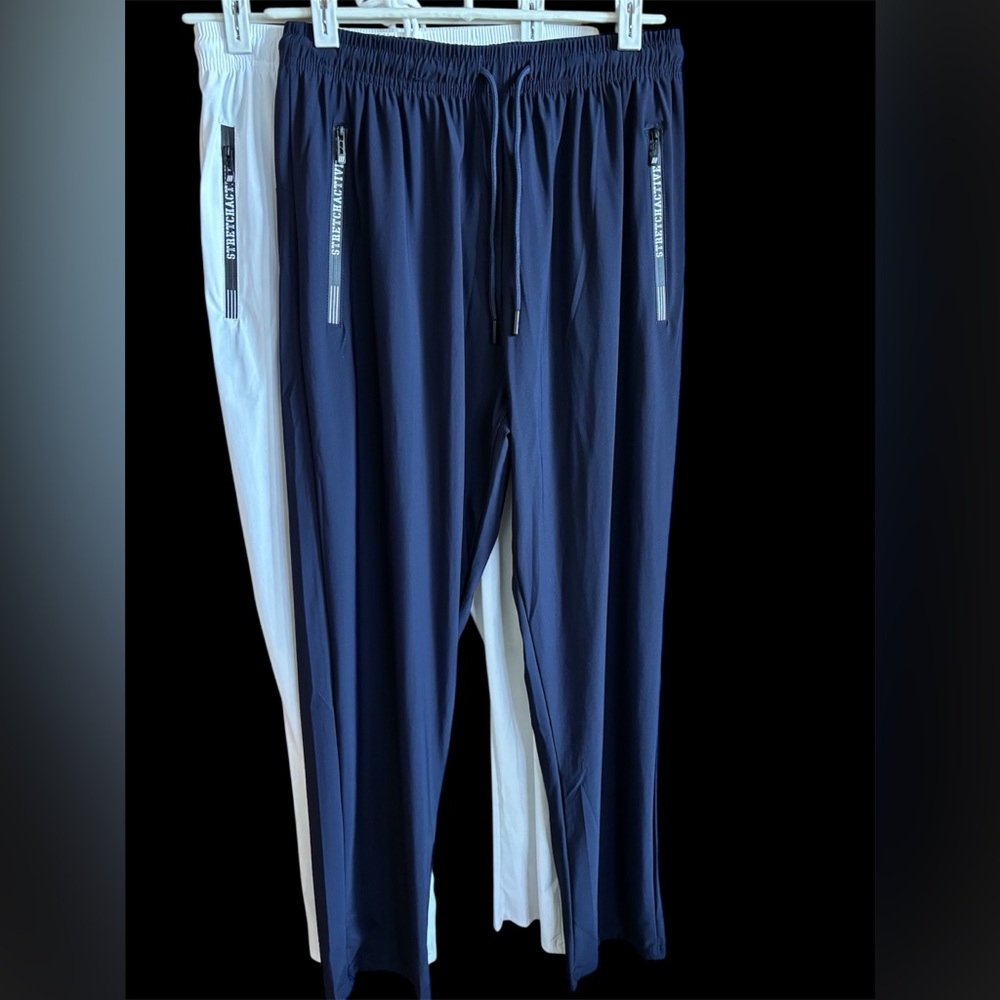 Two pair of StretchActive athletic wear, one navy blue and one white size medium